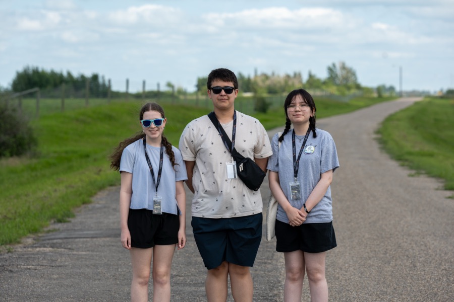 Three Kirkness Scholars on a gravel path during an outdoor field session