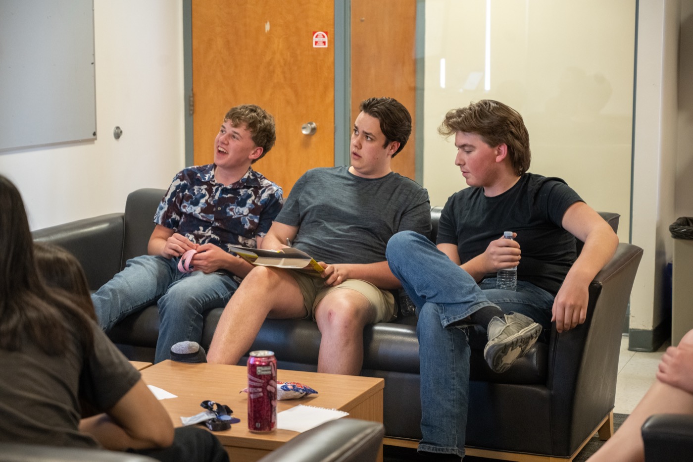 Students relaxing together in a university residence lounge