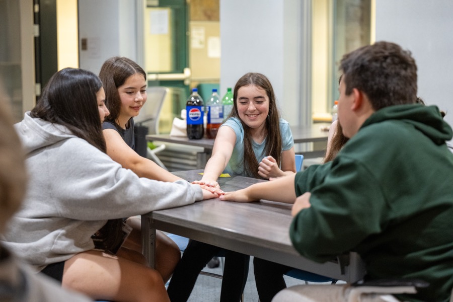 Kirkness Scholars sitting together around a table