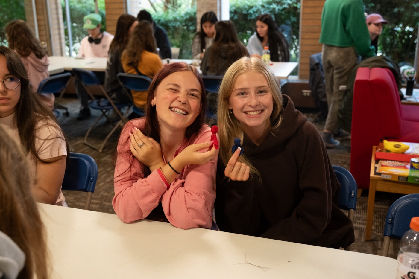 Two Kirkness Scholars laughing together during a group activity