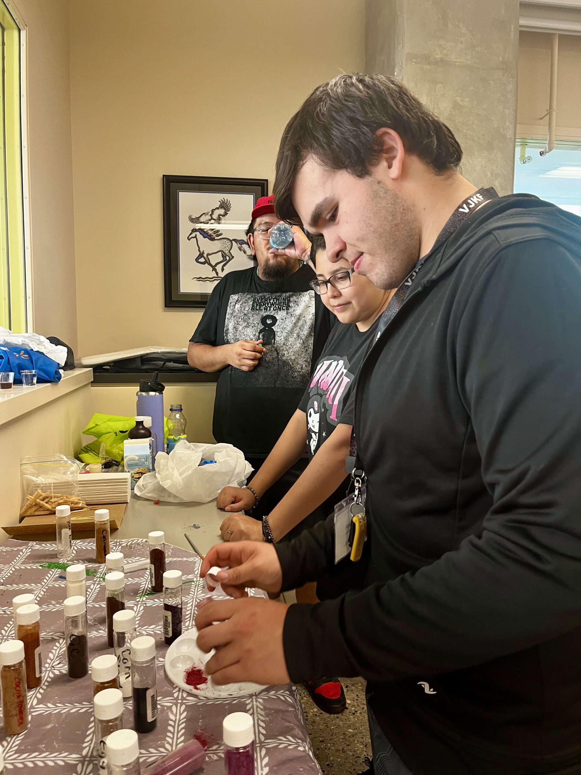 Student mixing traditional paints
